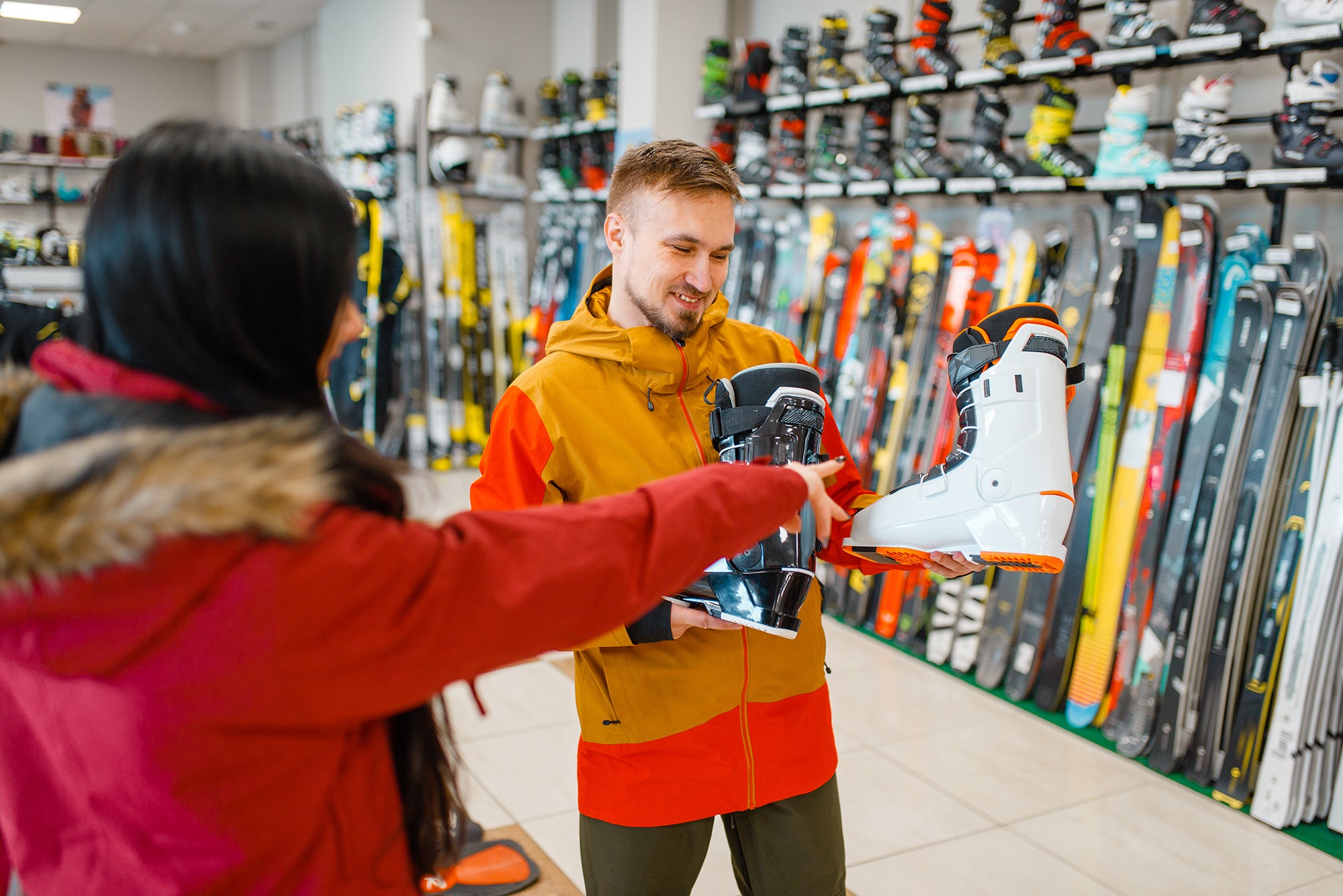 couple-choosing-ski-or-snowboarding-boots-2023-11-27-05-20-35-utc.jpg