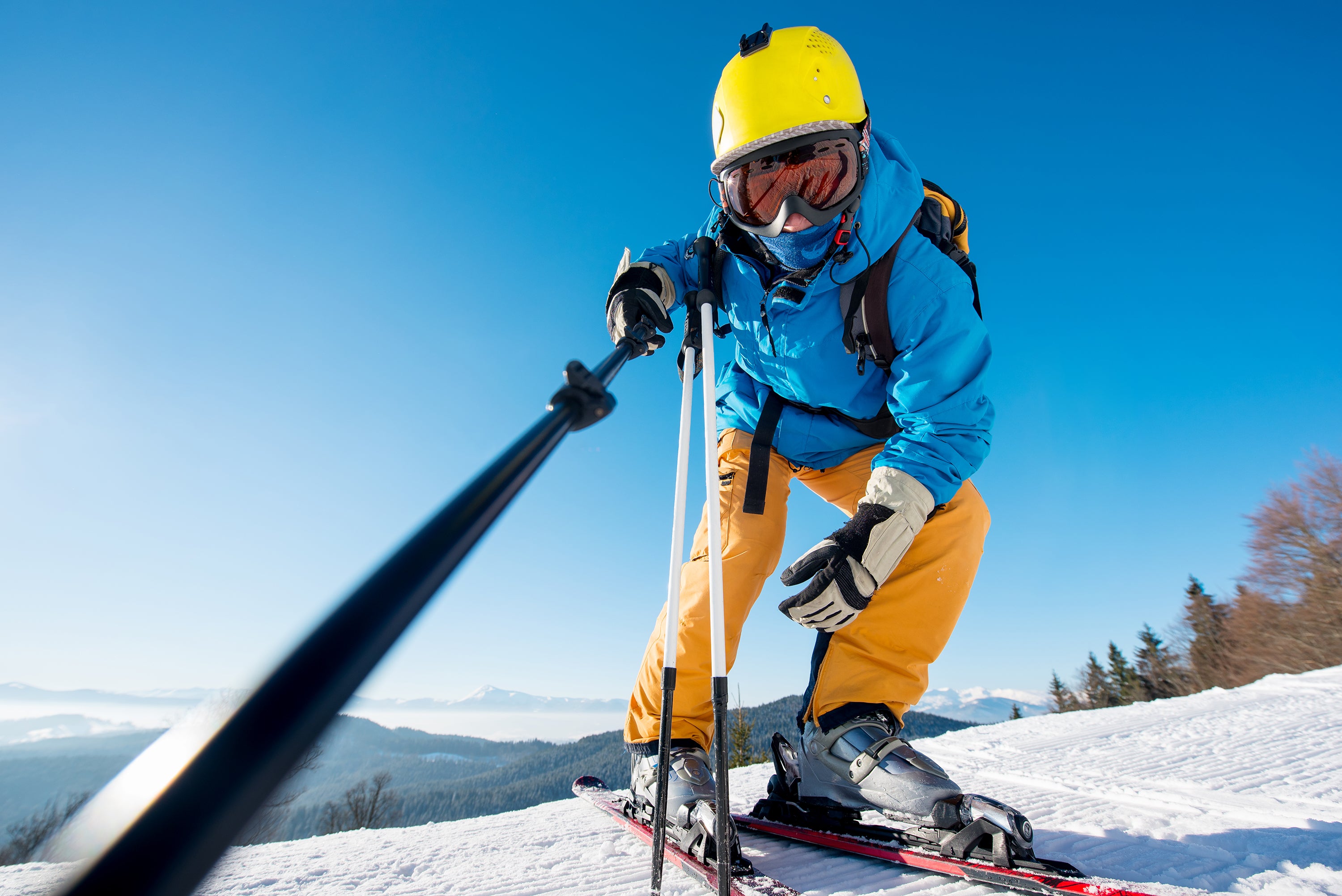 male-skier-using-selfie-stick-taking-photos-while-2023-11-27-05-14-44-utc.jpg